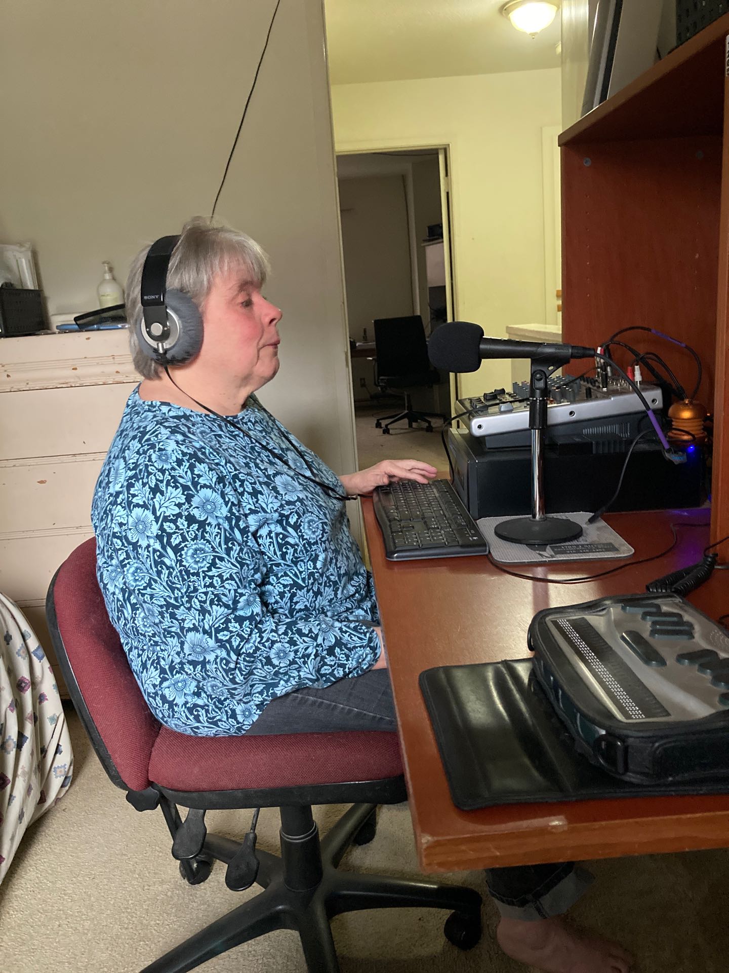 Photo of Ann at audio console
